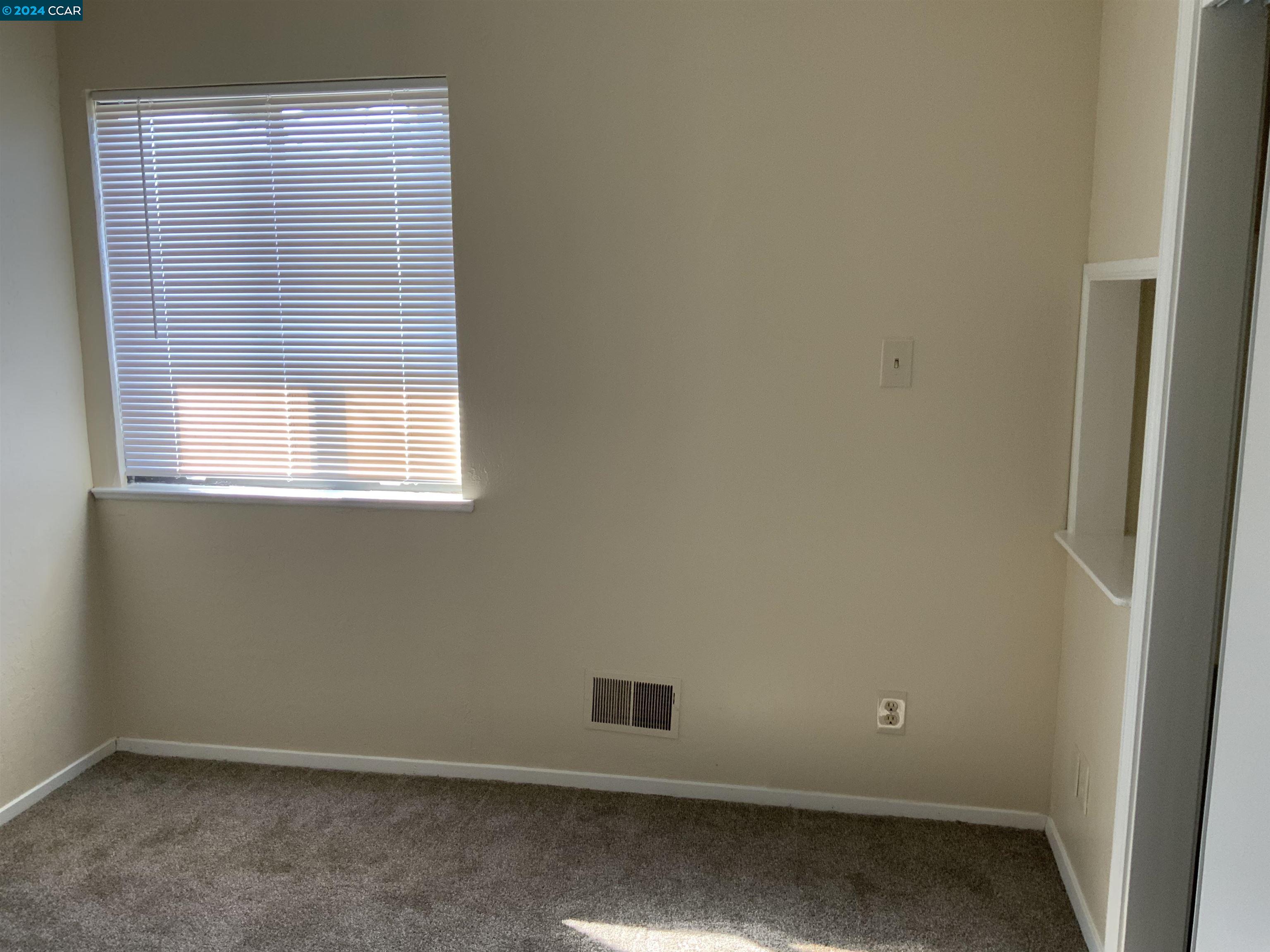 1311 Curtis Street Berkeley, CA 94702 - Photo 12 of 15 an empty room with a window