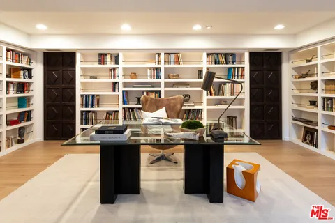a living room with furniture a window and kitchen view