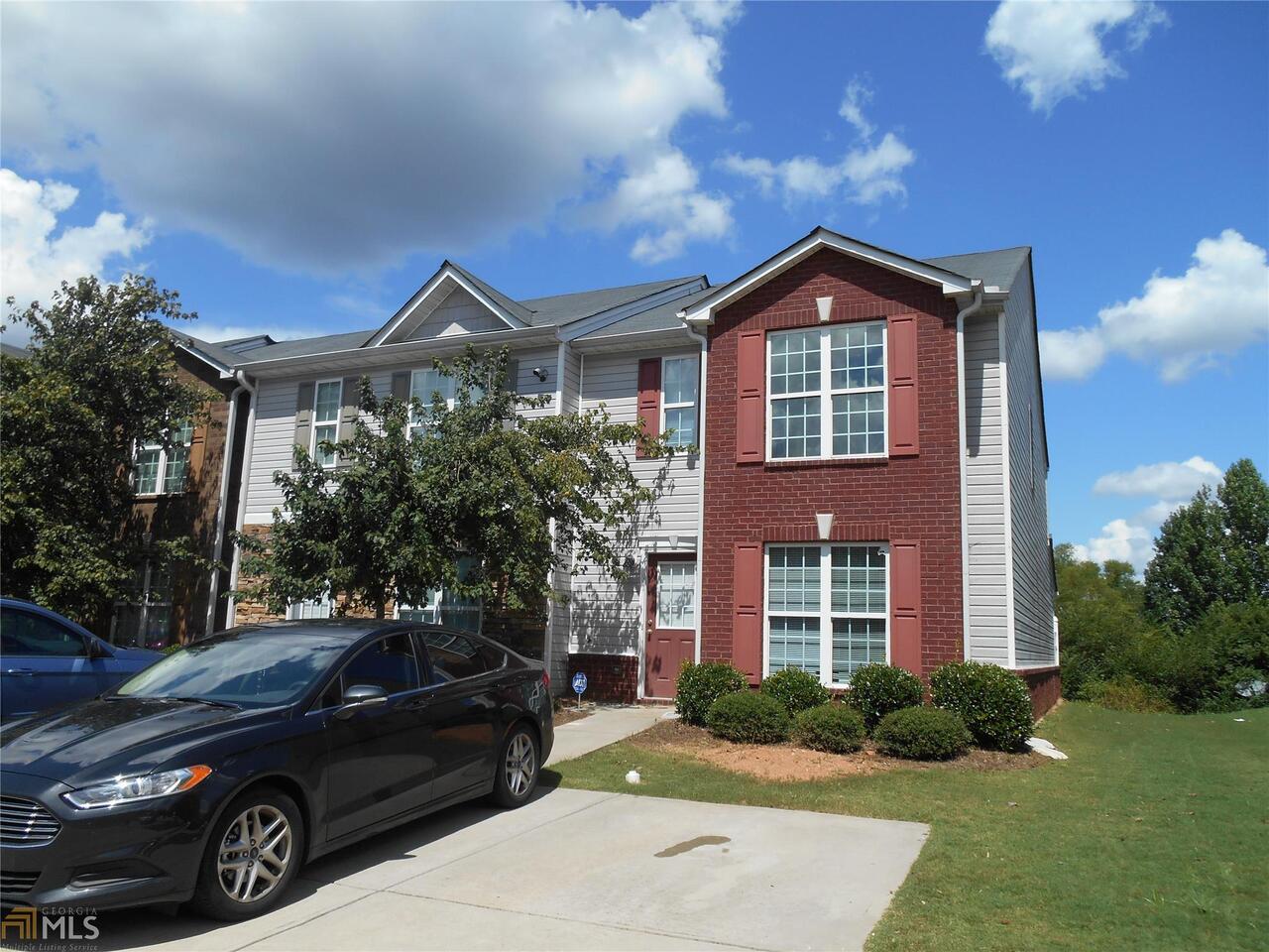 1870 Grove Way Hampton, GA 30228 - Photo 1 of 1 a front view of a house with a yard