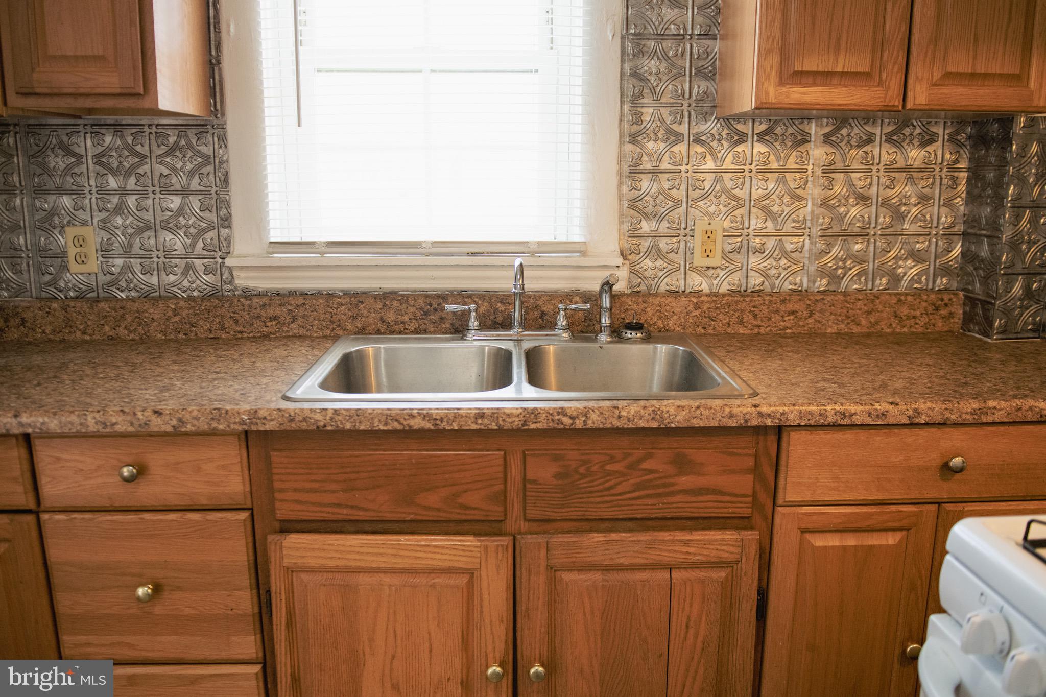 9 Hamilton Street New Castle, DE 19720 - Photo 13 of 20 a kitchen with a sink and cabinets
