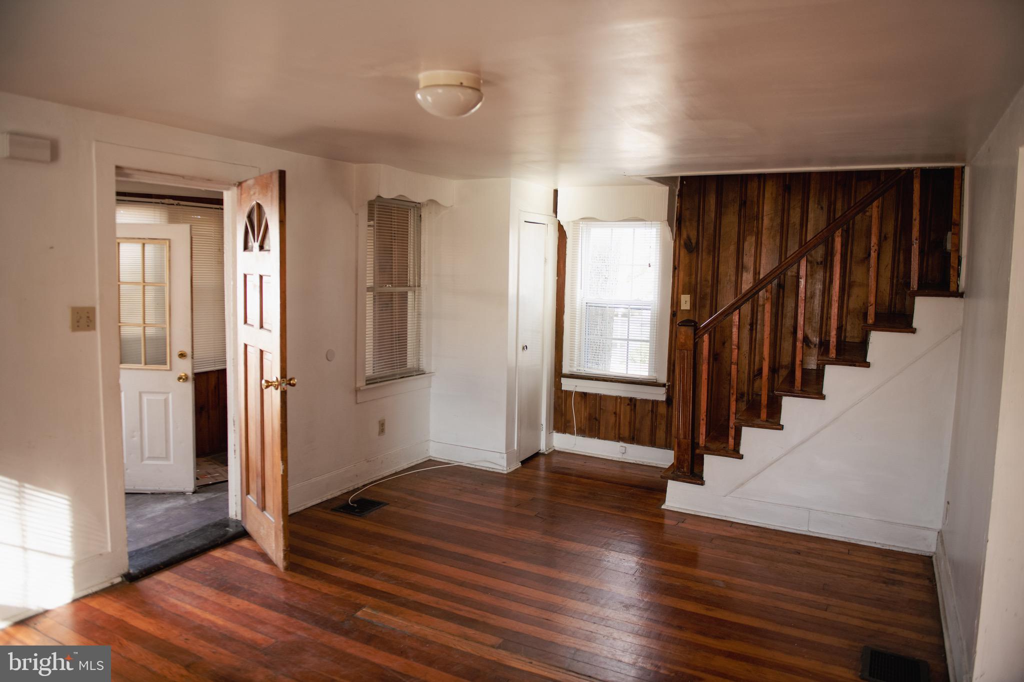 9 Hamilton Street New Castle, DE 19720 - Photo 8 of 20 a view of a hallway with wooden floor and stairs