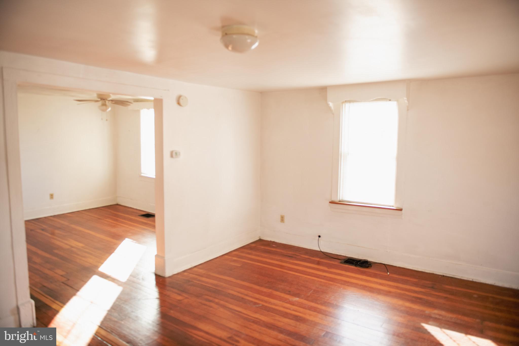 9 Hamilton Street New Castle, DE 19720 - Photo 10 of 20 a view of empty room with wooden floor