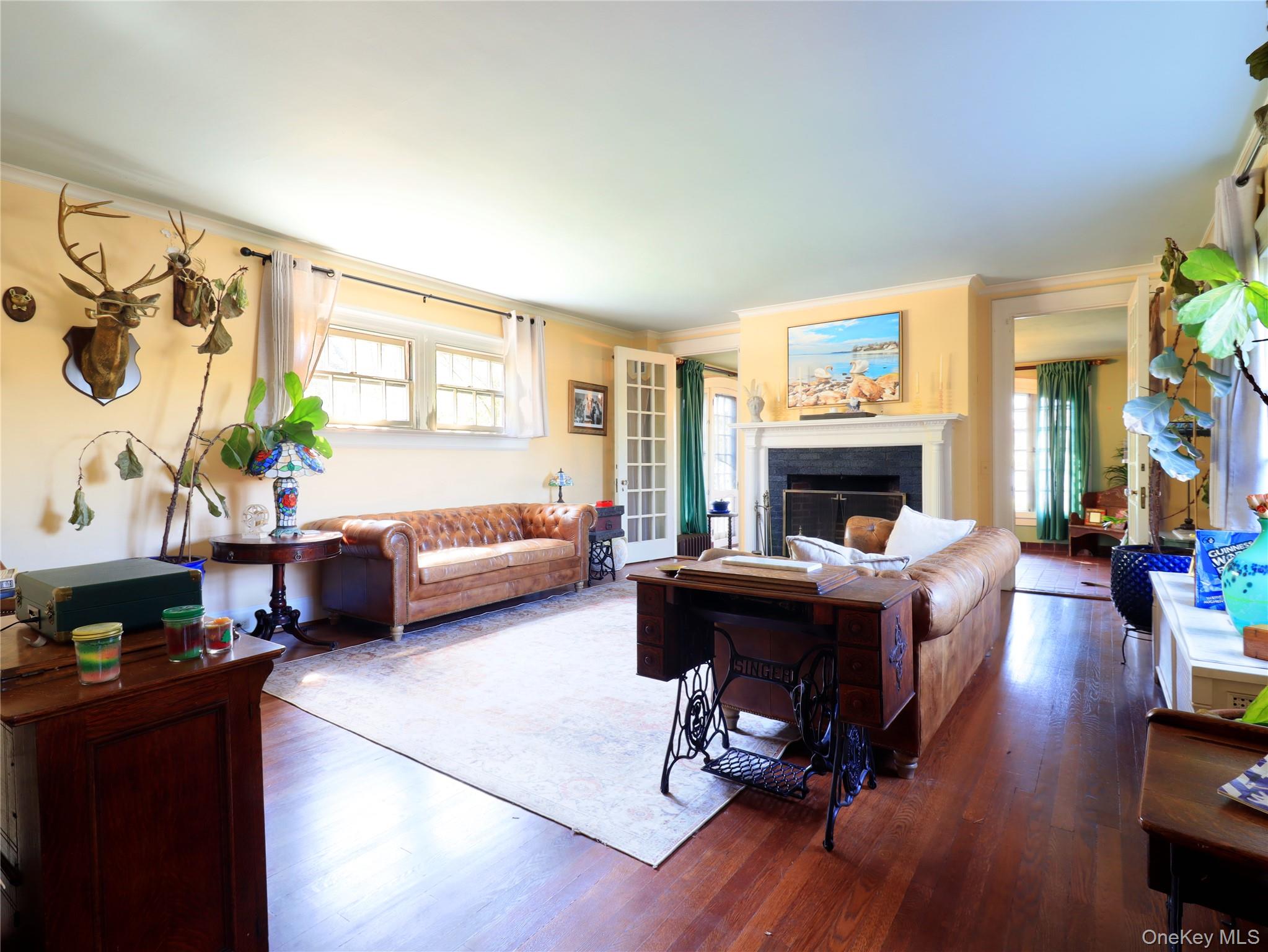 11-20 Shore Road Queens, NY 11363 - Photo 25 of 45 Spacious living area featuring polished wood flooring and a central area rug