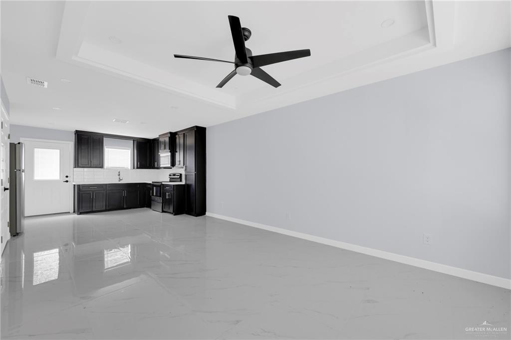 1612 Shadow Creek, Unit 3 Weslaco, TX 78596 - Photo 4 of 14 a view of kitchen with refrigerator and window