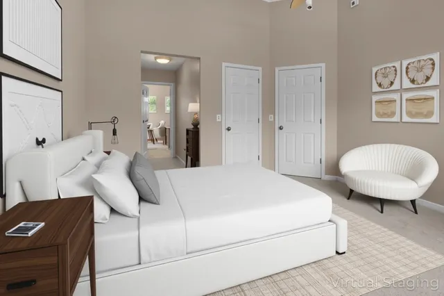 a bedroom with a bed and a chair