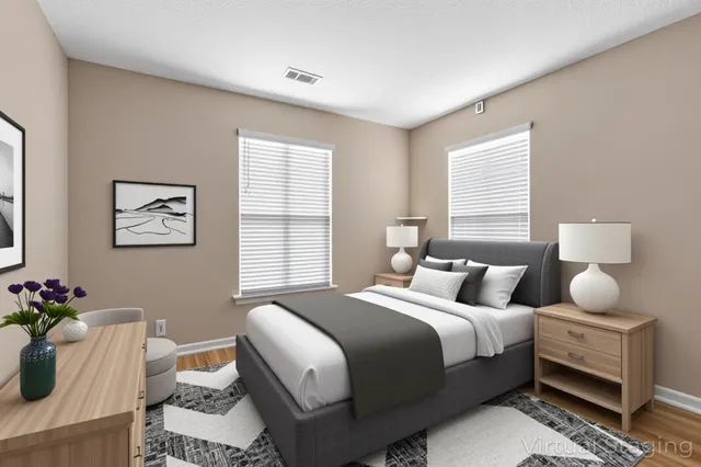 a bedroom with a bed and window