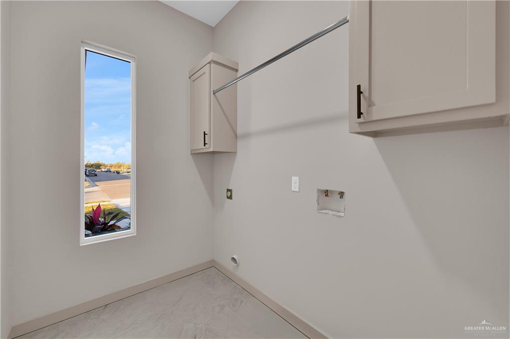 608 Spring Drive Alton, TX 78573 - Photo 18 of 32 Washroom with cabinet space, hookup for a washing machine, and hookup for an electric dryer