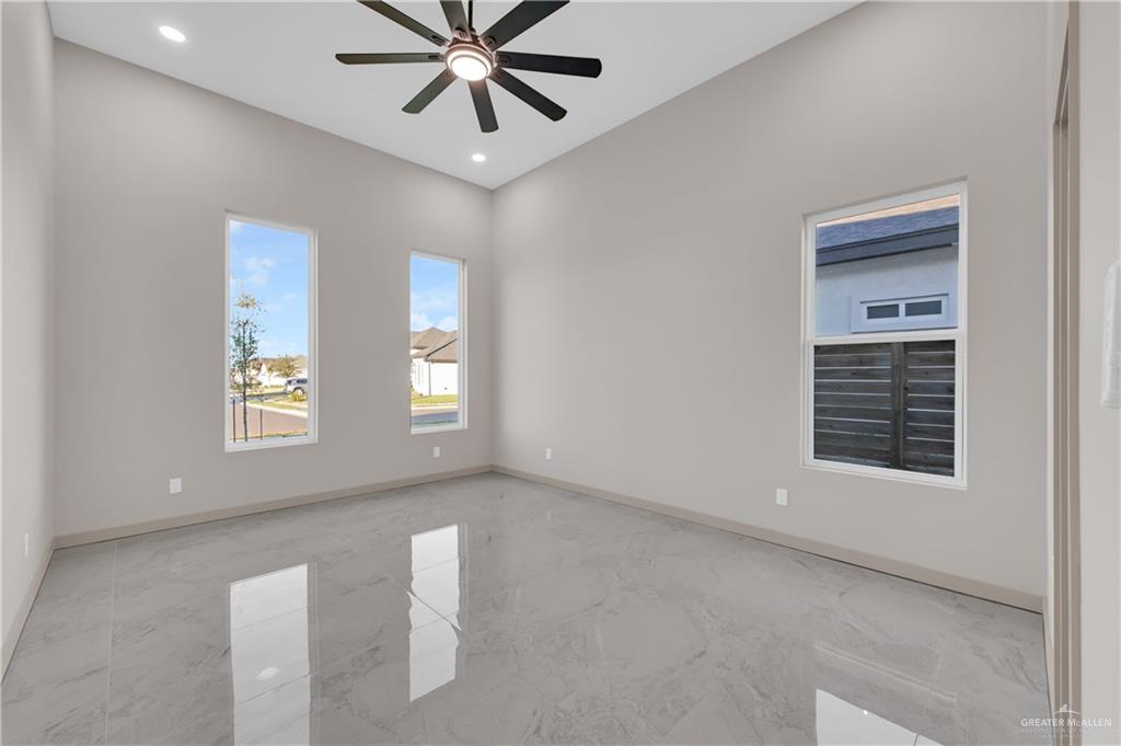608 Spring Drive Alton, TX 78573 - Photo 19 of 32 Spare room with recessed lighting and a ceiling fan