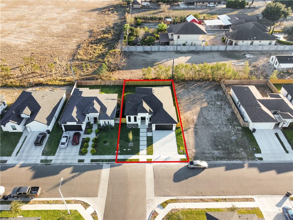 608 Spring Drive Alton, TX 78573 - Photo 27 of 32 Aerial perspective of suburban area featuring property parcel outlined