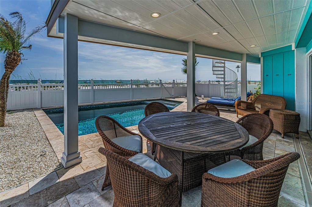 13303 Gulf Lane Madeira Beach, FL 33708 - Photo 5 of 42 a outdoor dining space with furniture and outdoor view