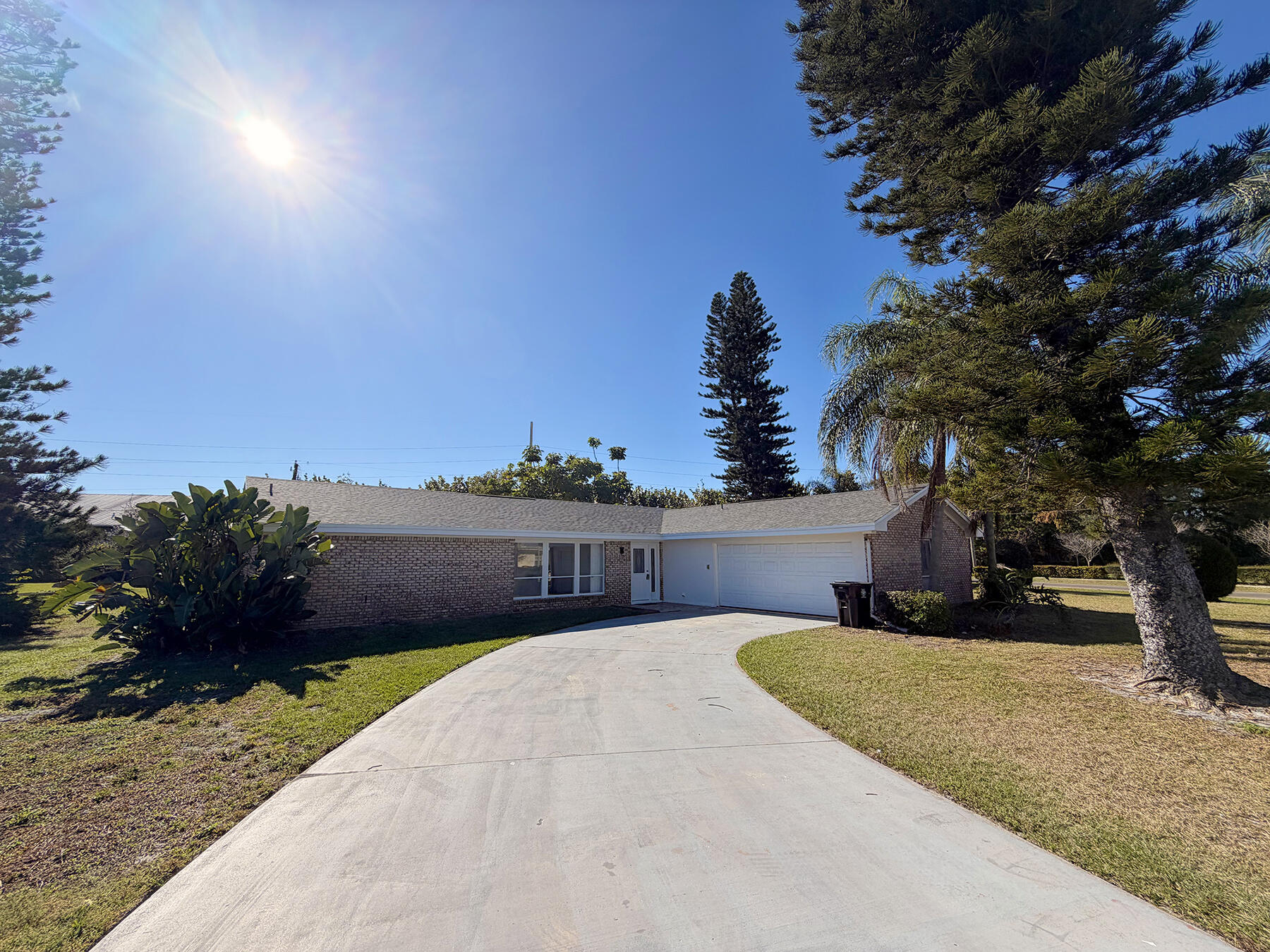 1902 Southeast Gena Road Port St. Lucie, FL 34952 - Photo 2 of 9 a view of a house with a yard