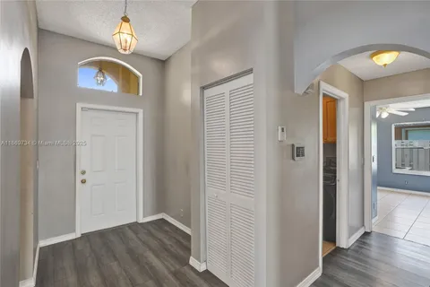 a view of an entryway with wooden floor