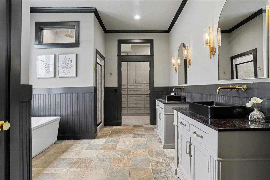 3923 Ranch Estates Circle Plano, TX 75074 - Photo 14 of 32 a bathroom with a granite countertop sink a toilet and shower
