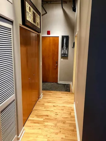 a view of a hallway with front door