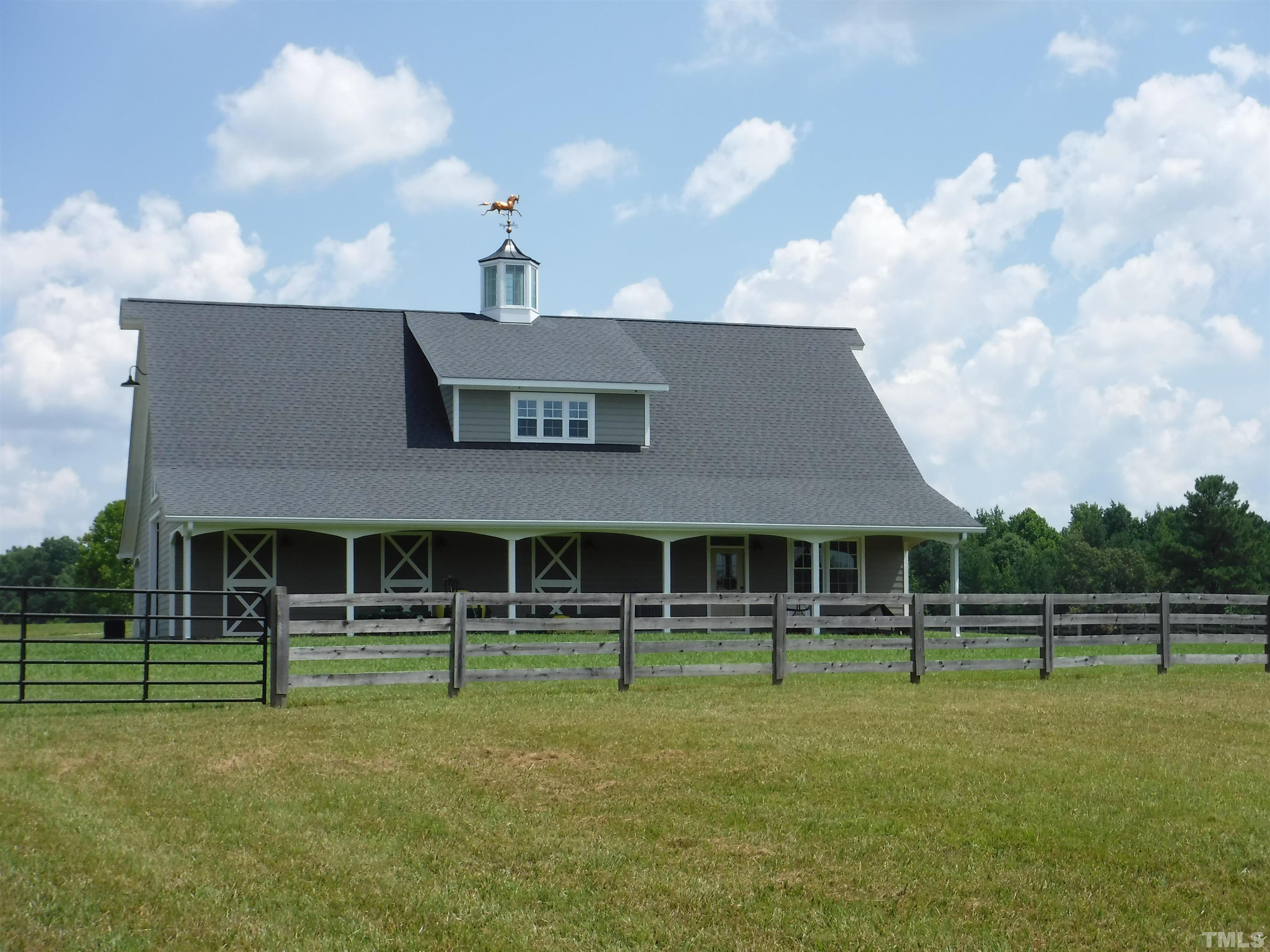 4708 Uzzle Road Rougemont, NC 27572 - Photo 12 of 51 a front view of a house with a yard