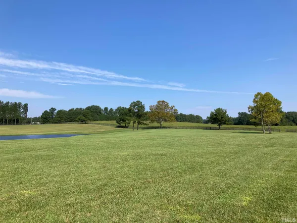 a view of a golf course with a lake