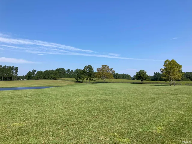 a view of a golf course with a lake
