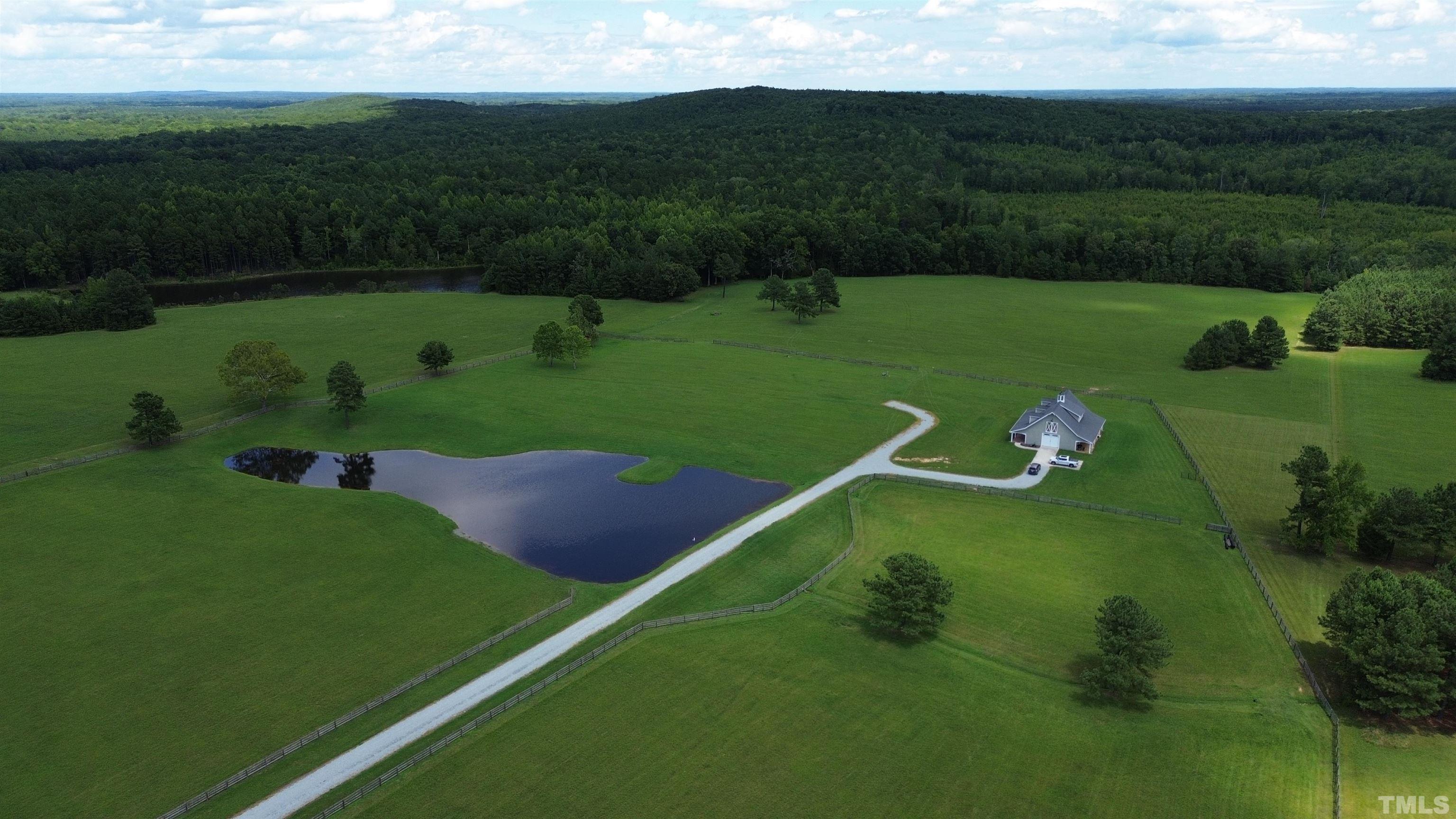 4708 Uzzle Road Rougemont, NC 27572 - Photo 20 of 51 a view of a golf course with a lake