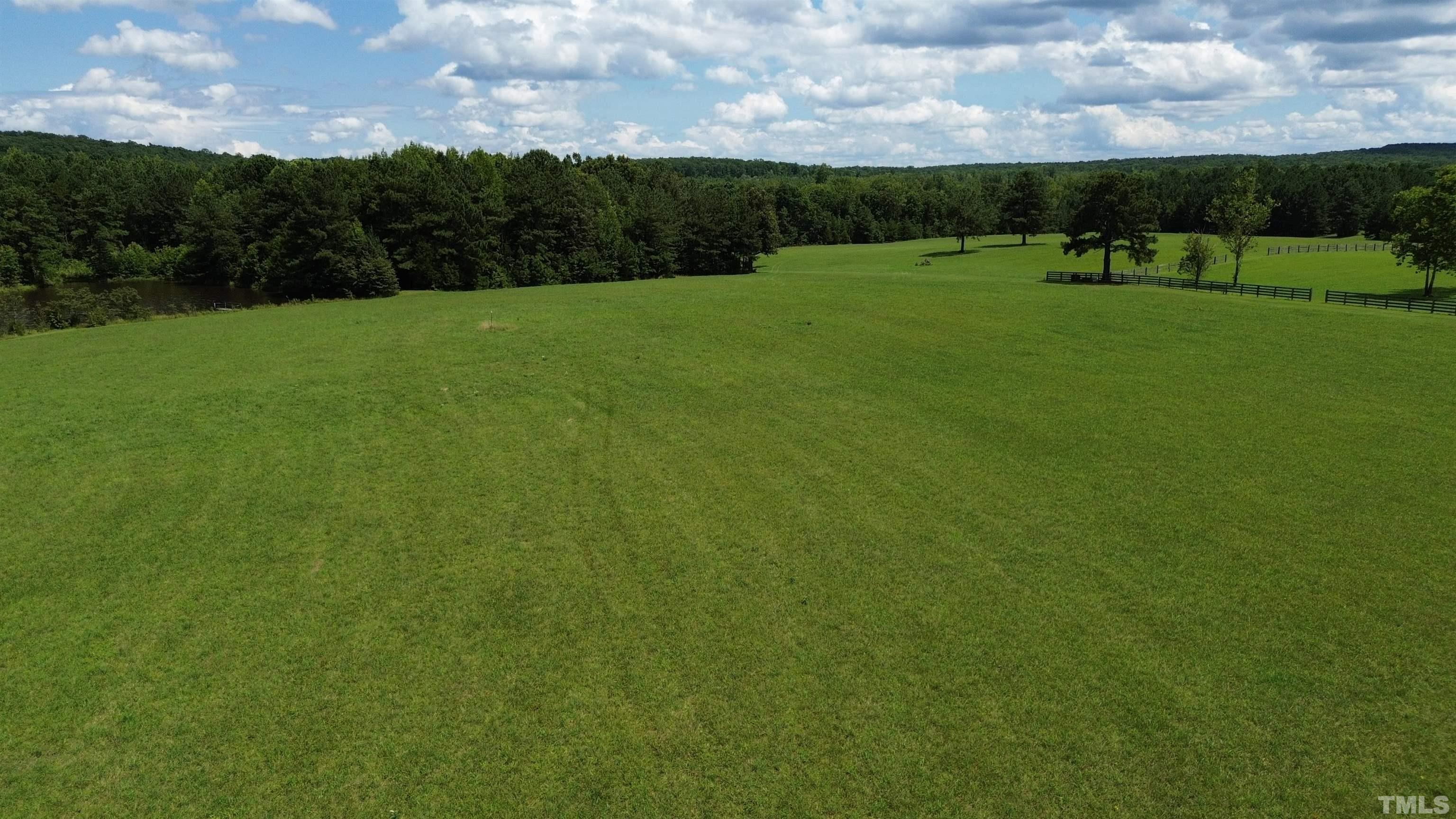 4708 Uzzle Road Rougemont, NC 27572 - Photo 22 of 51 a view of a golf course with a garden