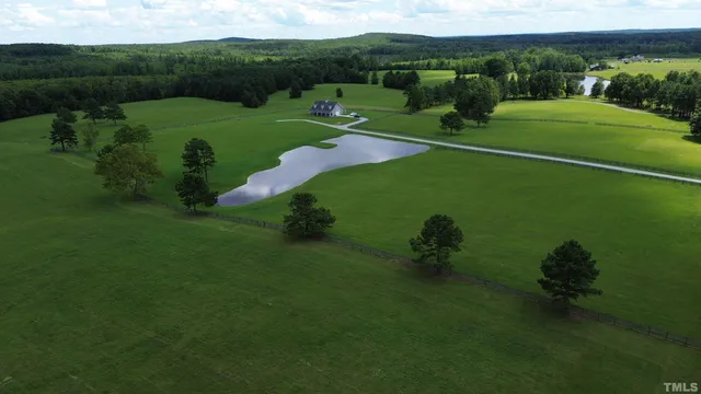 a view of a field with a lake