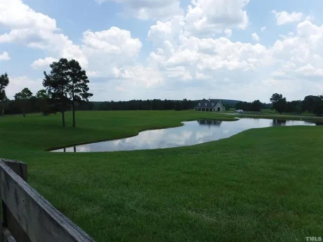 a view of a golf course with a lake