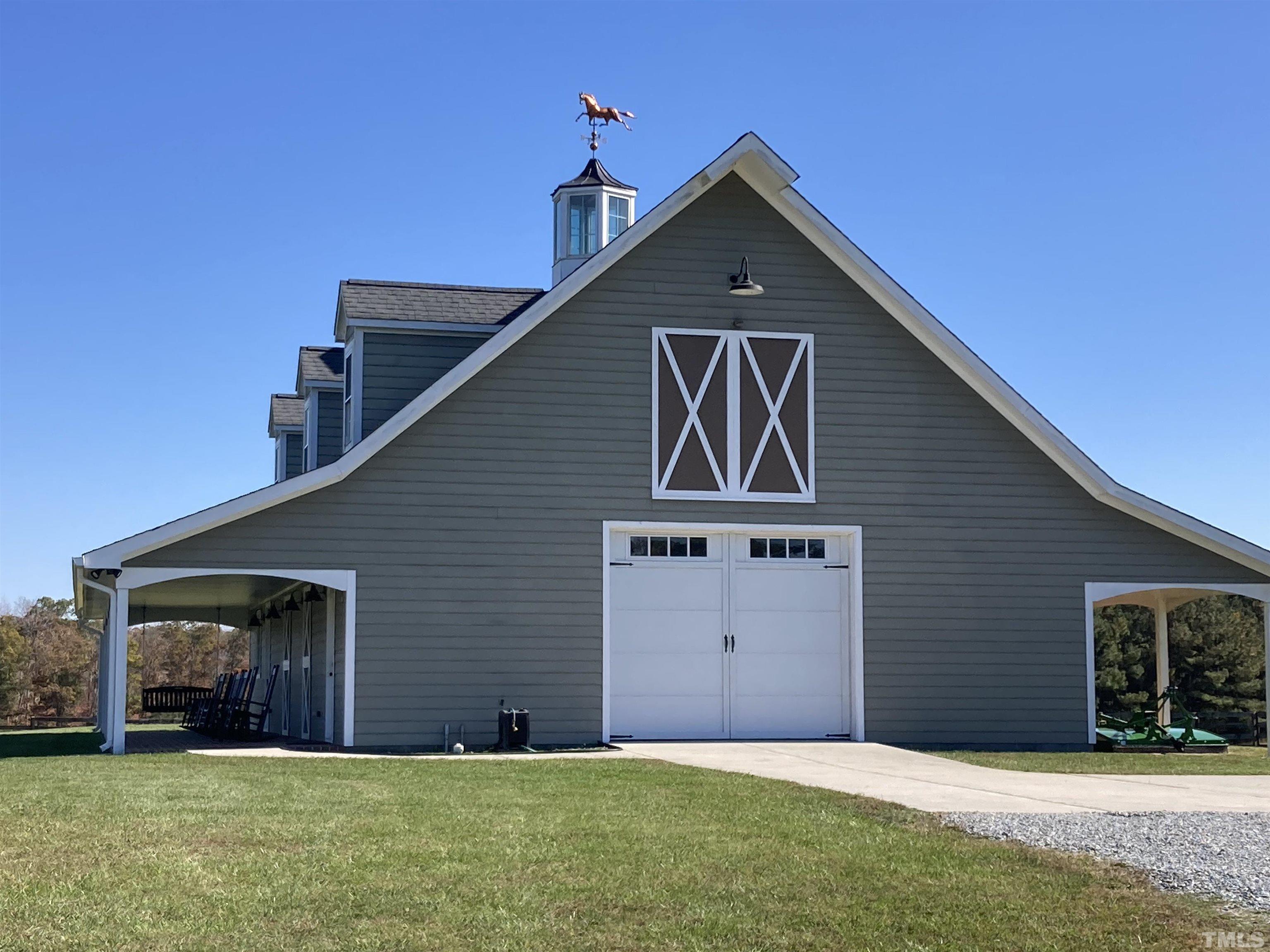 4708 Uzzle Road Rougemont, NC 27572 - Photo 9 of 51 a front view of a house with a yard