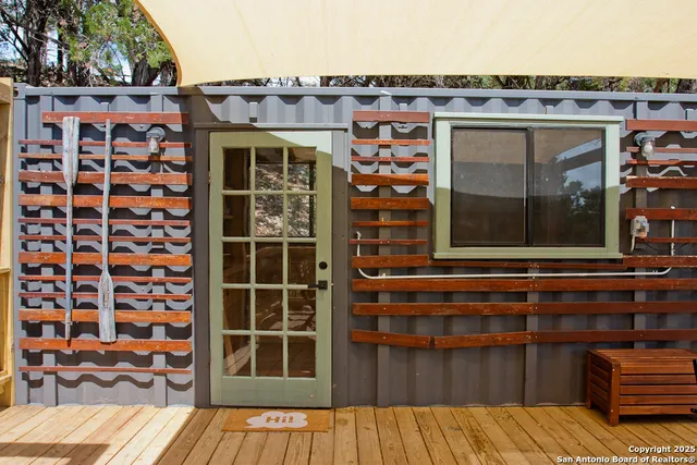 a front view of a house with a large window