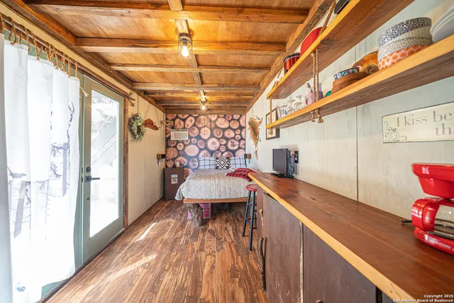 a view of balcony with a couple of chairs and a table