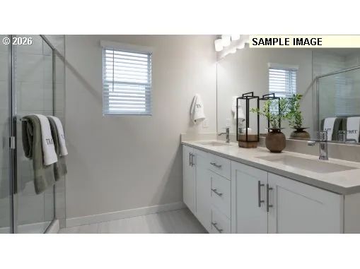 a bathroom with a sink a mirror and shower