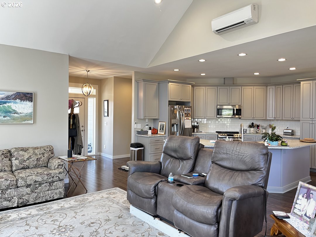 88097 Lake Point Drive Florence, OR 97439 - Photo 14 of 48 a living room with furniture and kitchen view