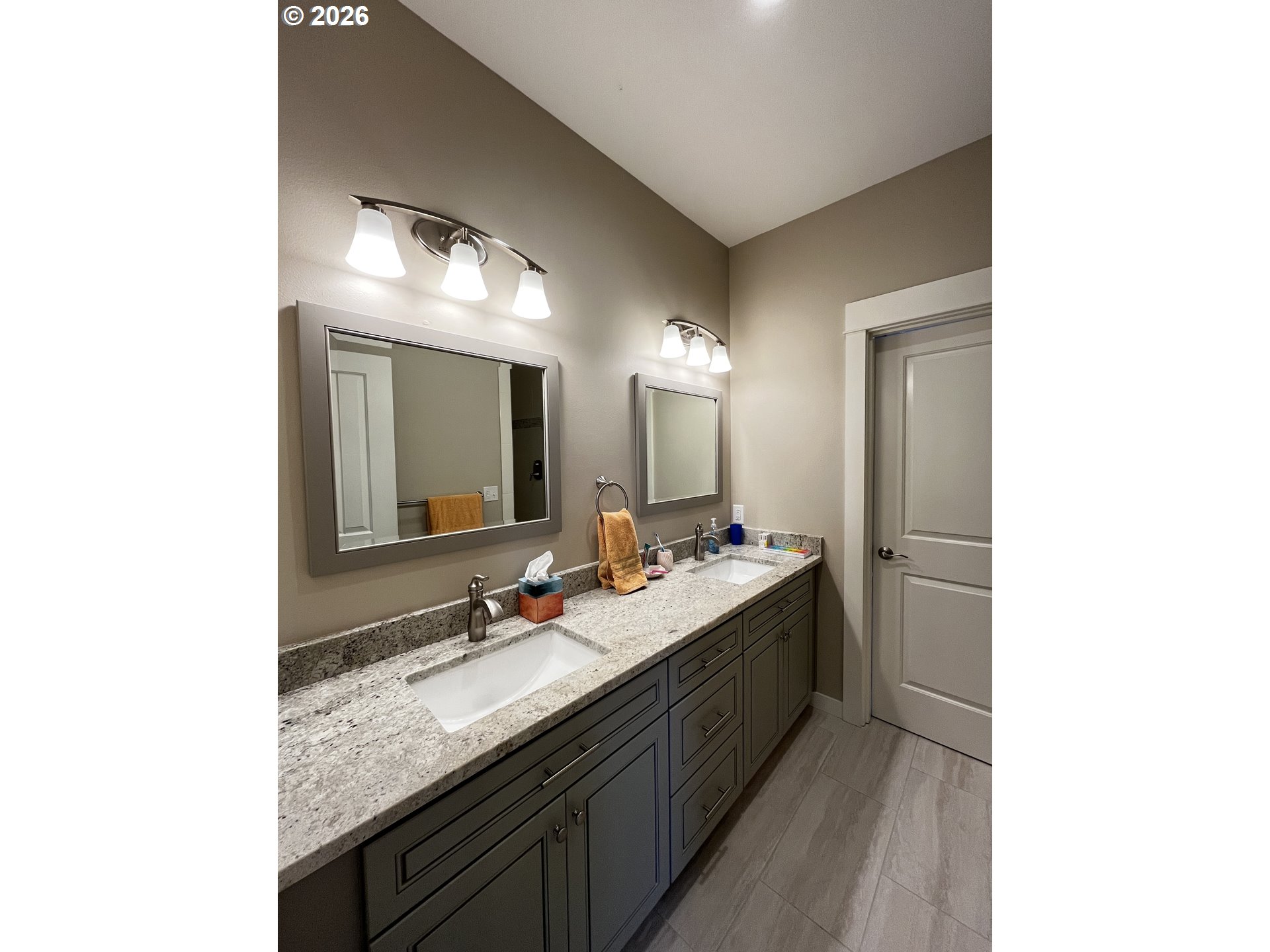 88097 Lake Point Drive Florence, OR 97439 - Photo 36 of 48 a bathroom with a granite countertop sink and a mirror
