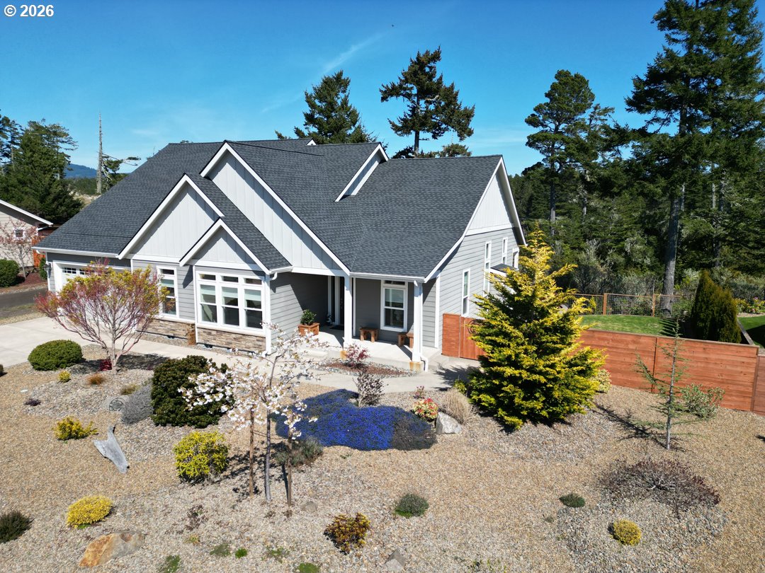 88097 Lake Point Drive Florence, OR 97439 - Photo 4 of 48 a front view of a house with a yard