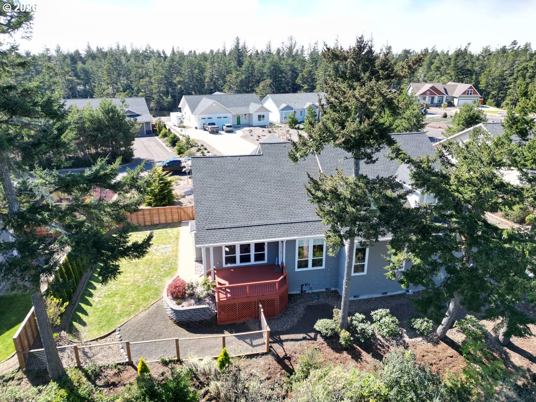 88097 Lake Point Drive Florence, OR 97439 - Photo 5 of 48 an aerial view of a house with garden space and street view
