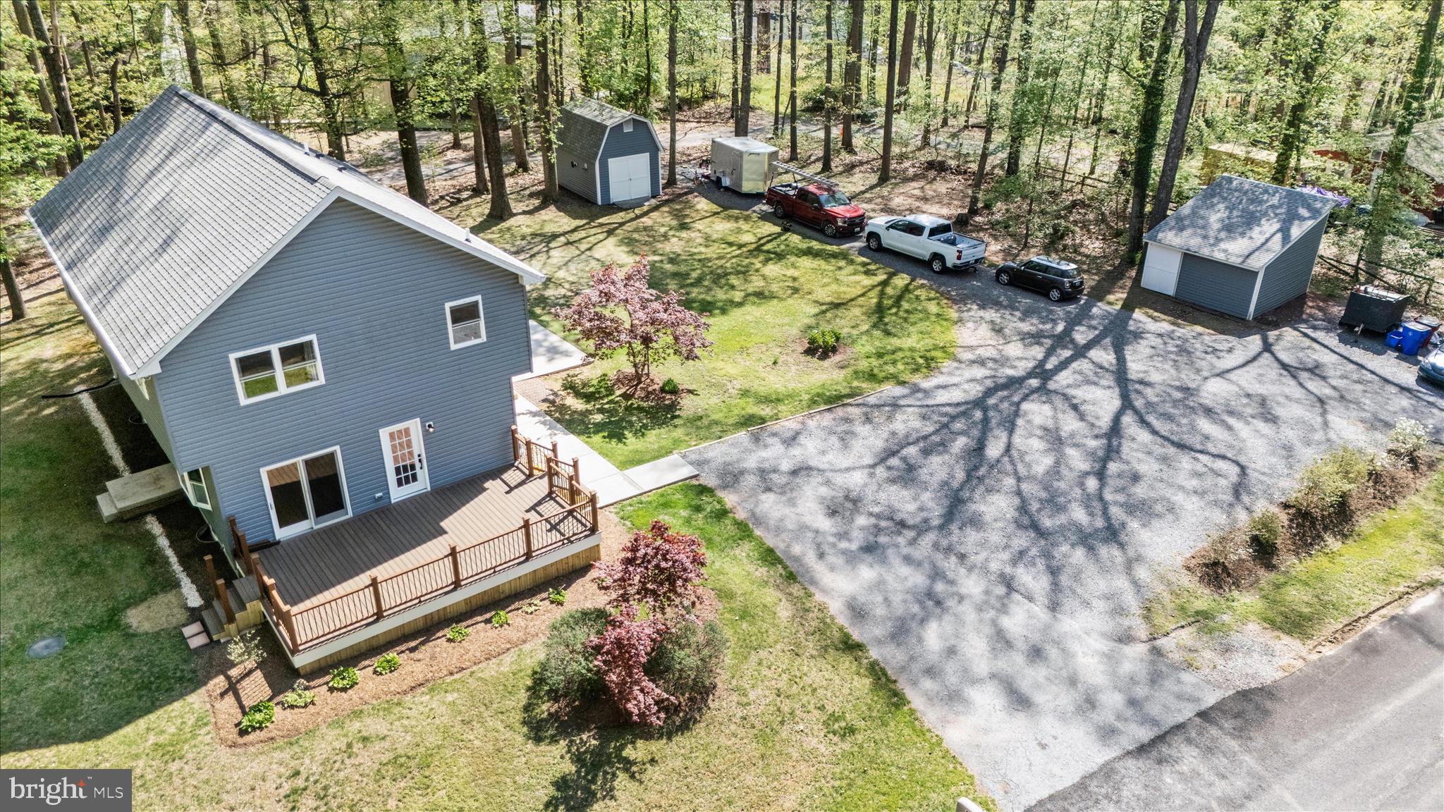 6518 Woodville Road Mount Airy, MD 21771 - Photo 40 of 53 a view of a backyard with chairs and a fire pit