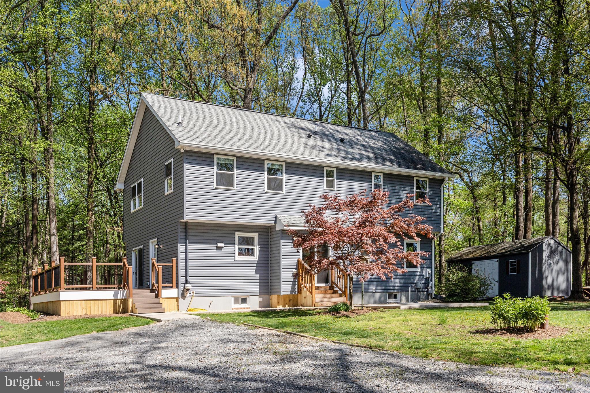 6518 Woodville Road Mount Airy, MD 21771 - Photo 43 of 53 a front view of a house with garden
