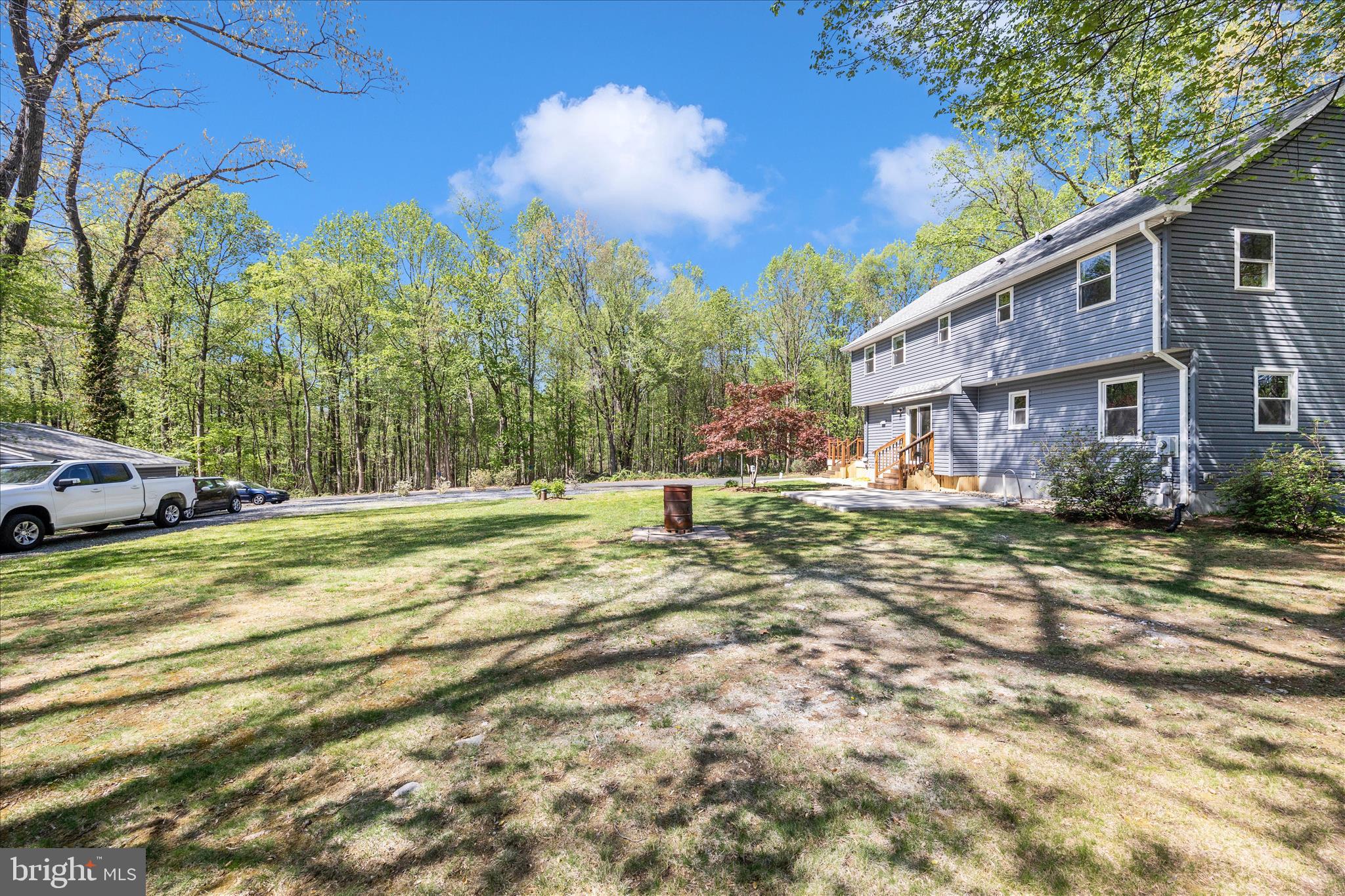 6518 Woodville Road Mount Airy, MD 21771 - Photo 45 of 53 a view of a house with a yard