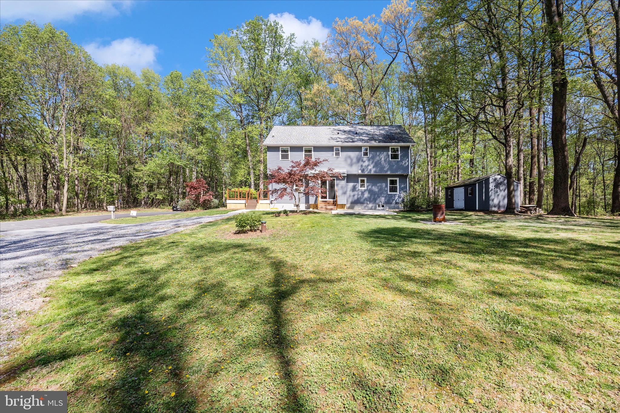 6518 Woodville Road Mount Airy, MD 21771 - Photo 46 of 53 a view of a house with a yard