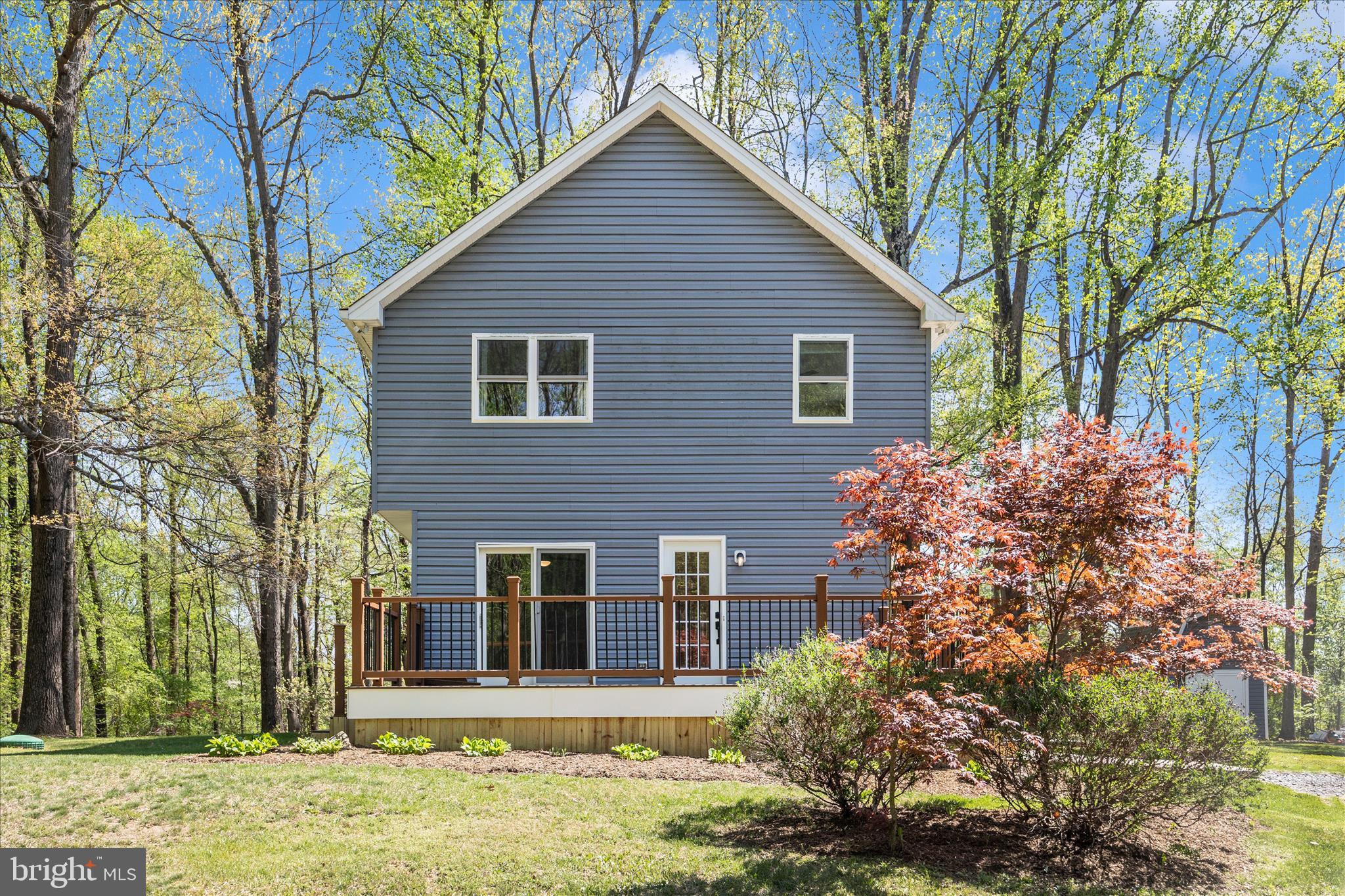 6518 Woodville Road Mount Airy, MD 21771 - Photo 52 of 53 a front view of a house with garden
