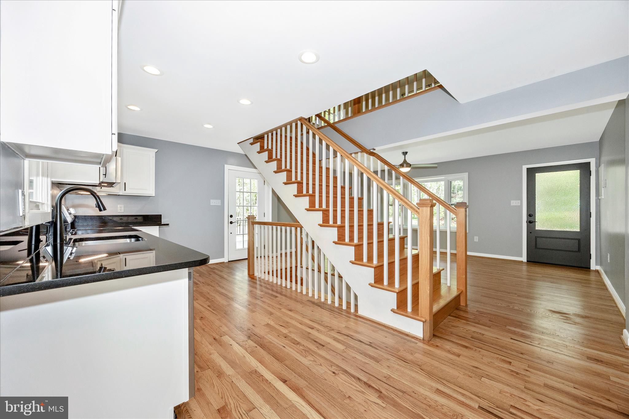 6518 Woodville Road Mount Airy, MD 21771 - Photo 8 of 53 a view of a kitchen with wooden floor and electronic appliances