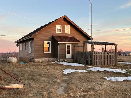 a front view of a house with a fence