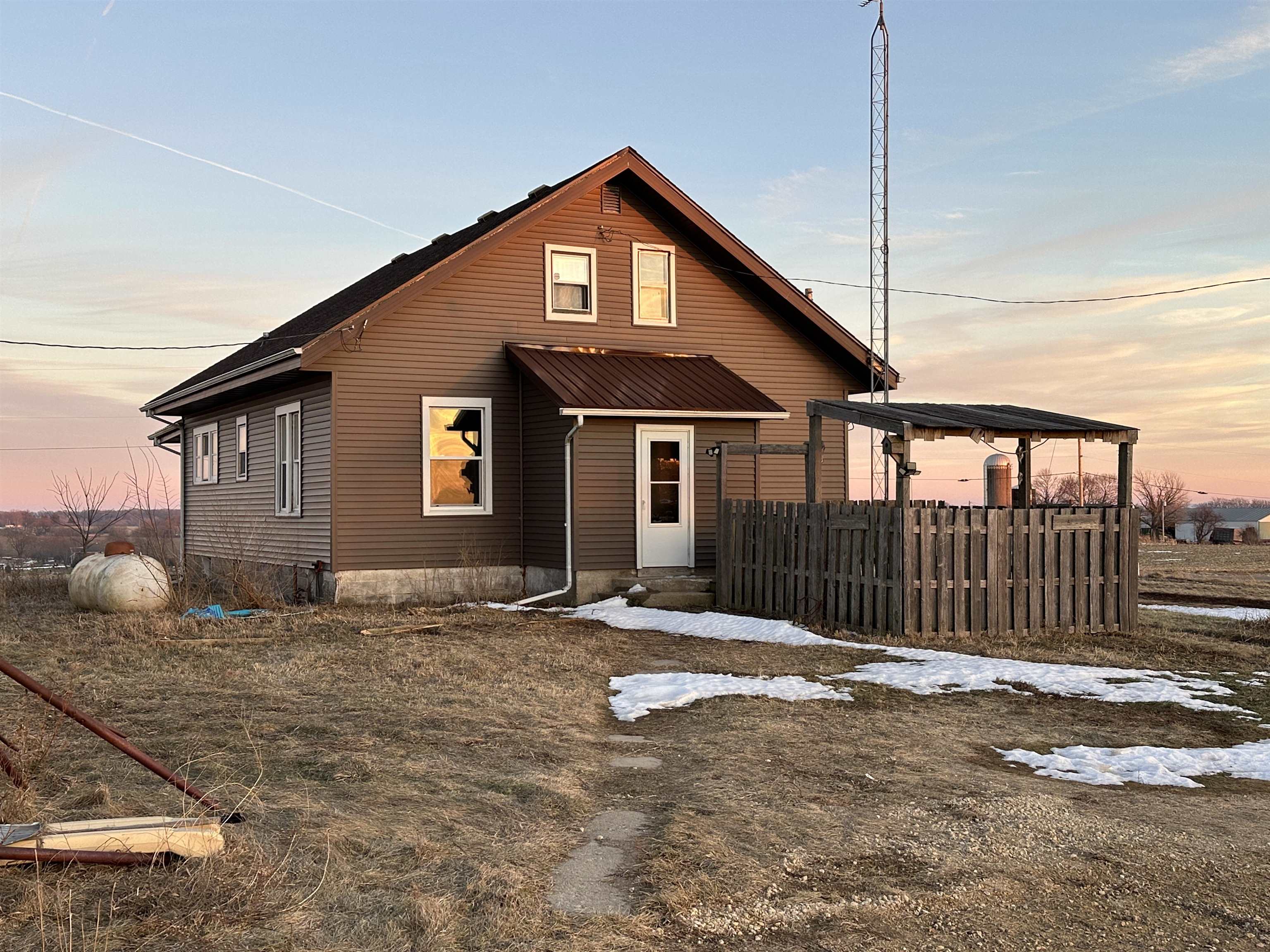 2750 North Henderson Road Freeport, IL 61032 - Photo 3 of 19 a front view of a house with a fence