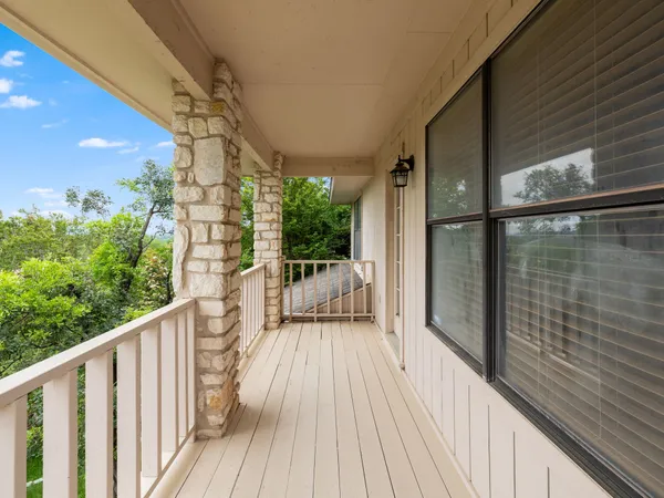 a view of a balcony with wooden floor