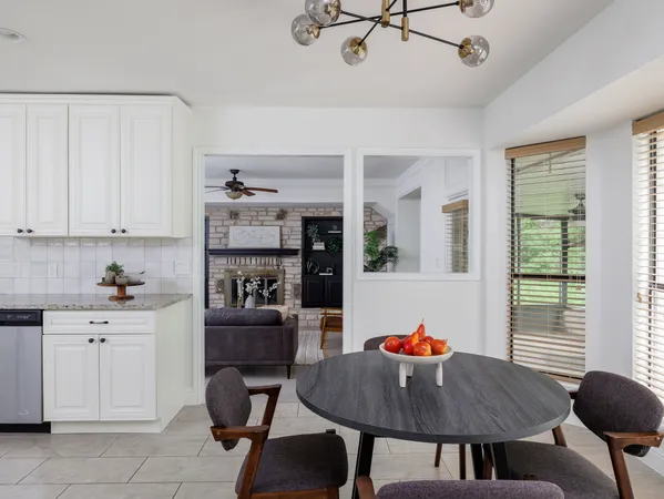 a dining room with furniture and window