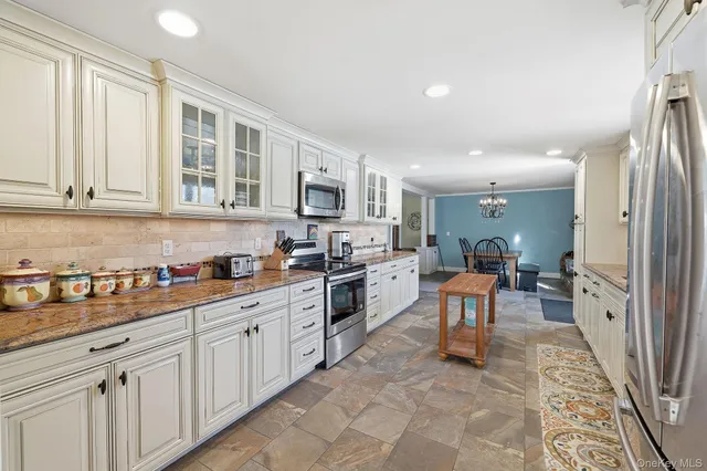 a kitchen with sink cabinets and window