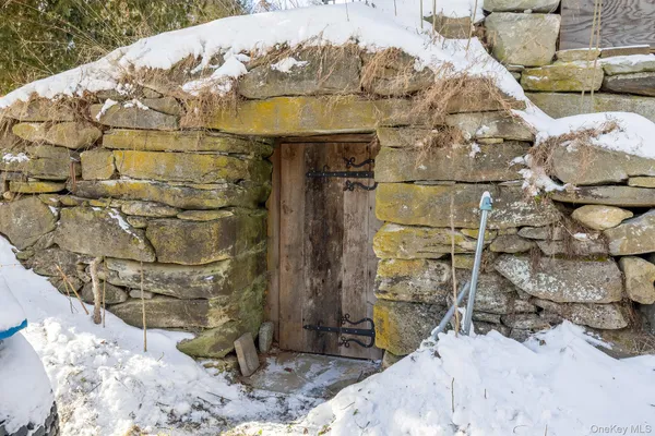 a view of a fireplace in the backyard