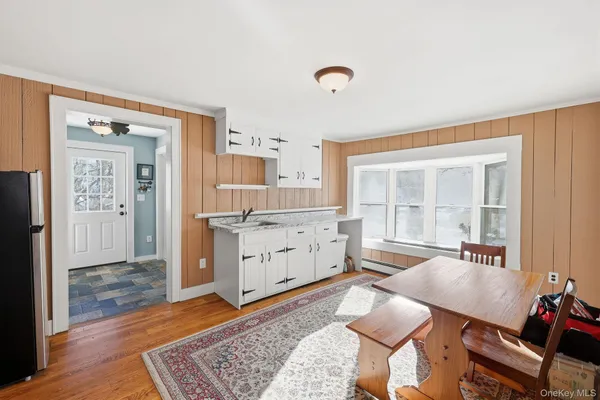 a room with furniture and wooden floor