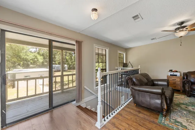 a bedroom with furniture and a window