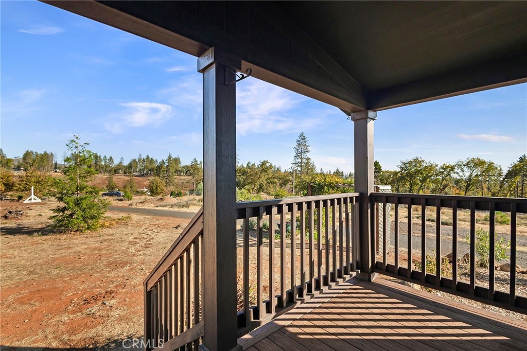 1798 Stearns Road Paradise, CA 95969 - Photo 2 of 39 a view of a balcony with wooden floor & fence