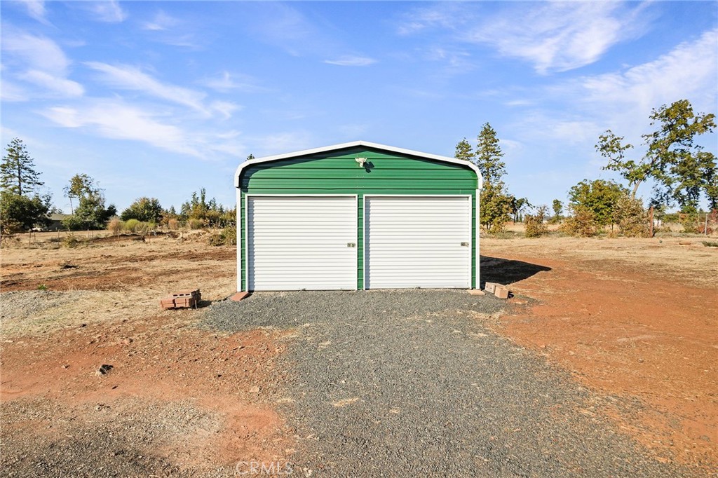 1798 Stearns Road Paradise, CA 95969 - Photo 24 of 39 a front view of a house with a yard and garage