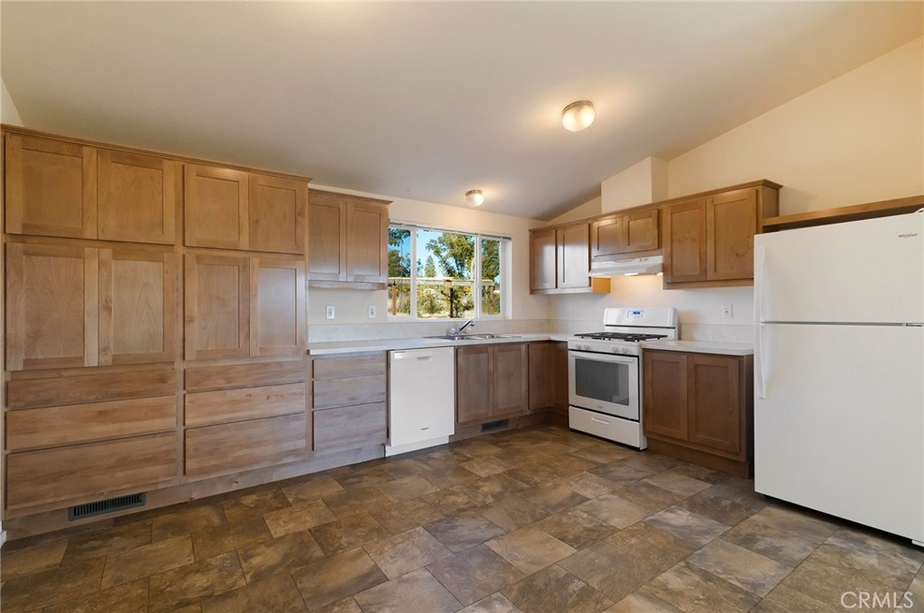 1798 Stearns Road Paradise, CA 95969 - Photo 9 of 39 a kitchen with sink cabinets and window